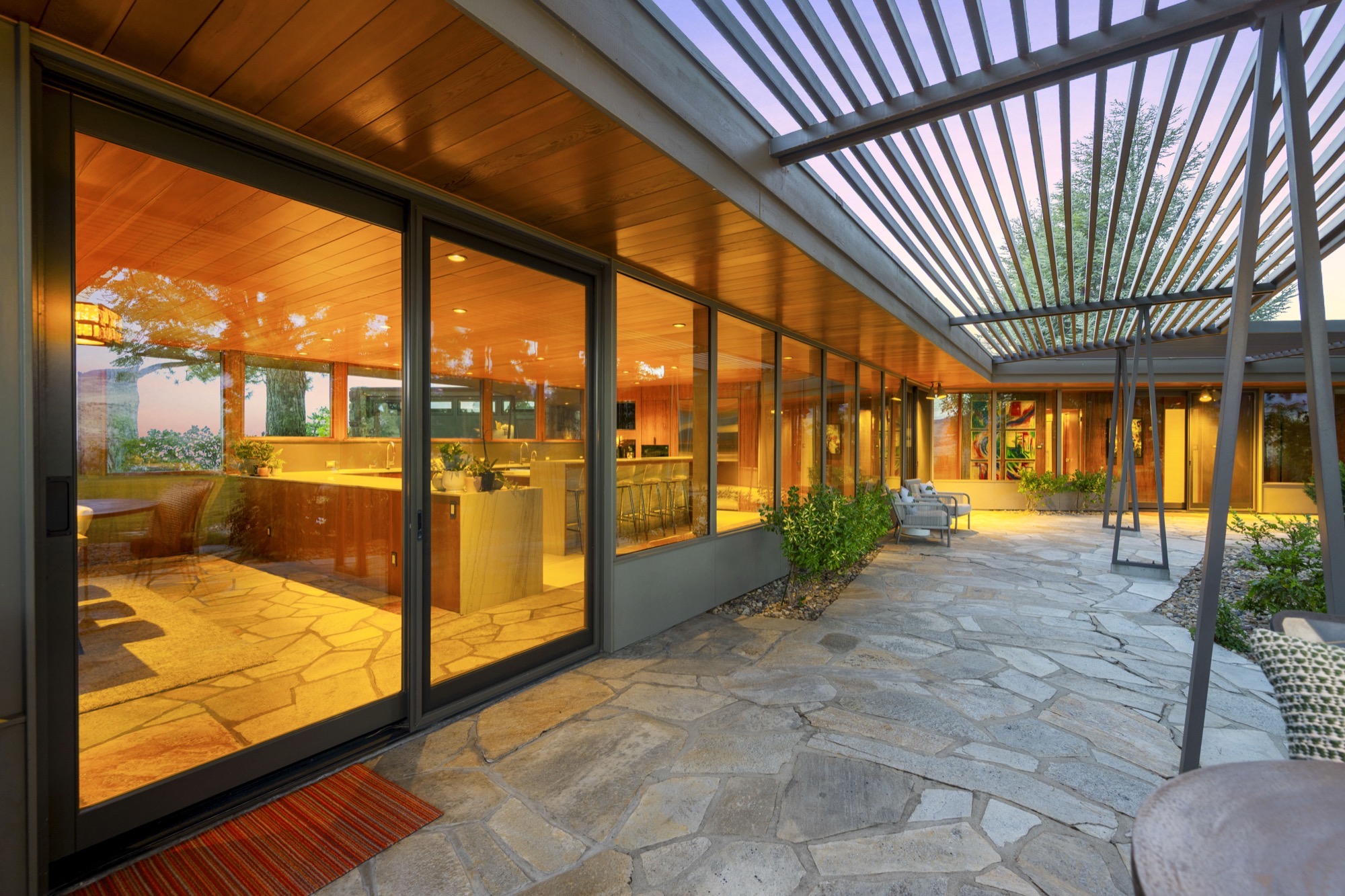Outdoor patio at dusk with soft lighting and horizon views